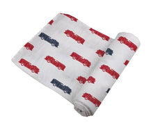 Load image into Gallery viewer, blue and red fire trucks swaddle