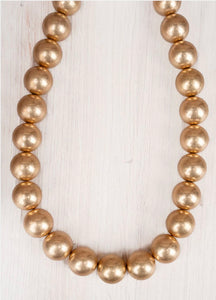 worn goldtone pearl necklace