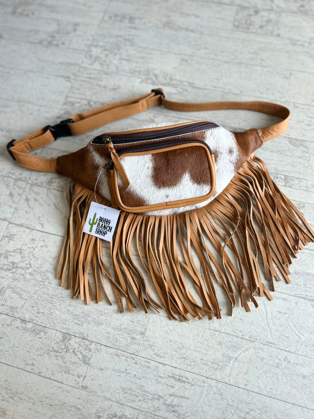 cowhide fanny pack, tan + white