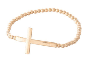 beaded cross bracelet, worn gold